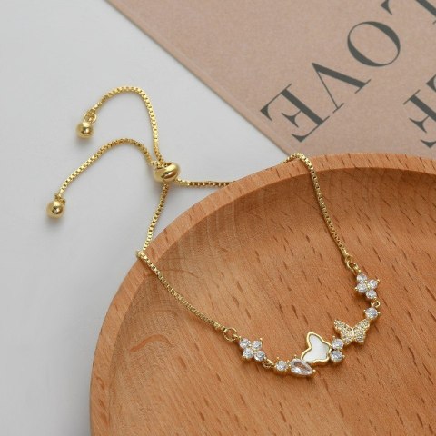 Bransoletka na rękę stal chirurgiczna pozłacana 14k złotem, MOTYLKI cyrkonie BST1530 Bransoletka na rękę stal chirurgiczna pozłacana 14k złotem, MOTYLKI cyrkonie BST1530